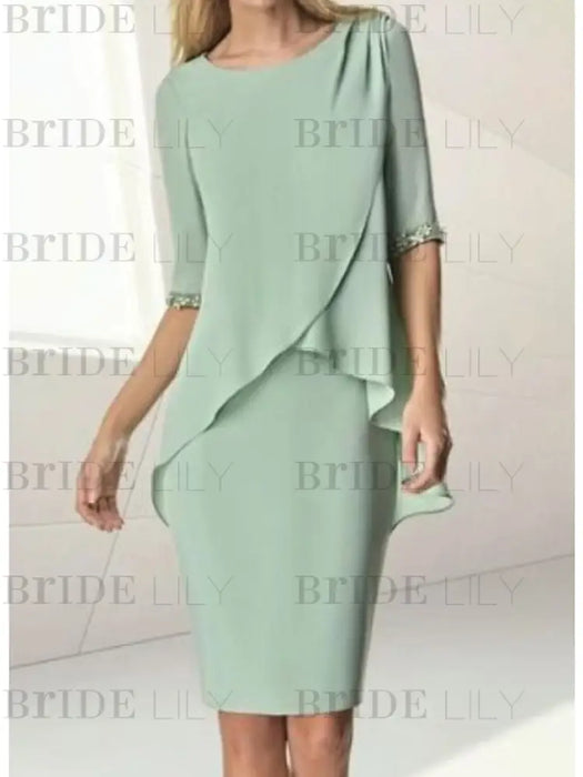 Full length view of the sage green chiffon overlay dress