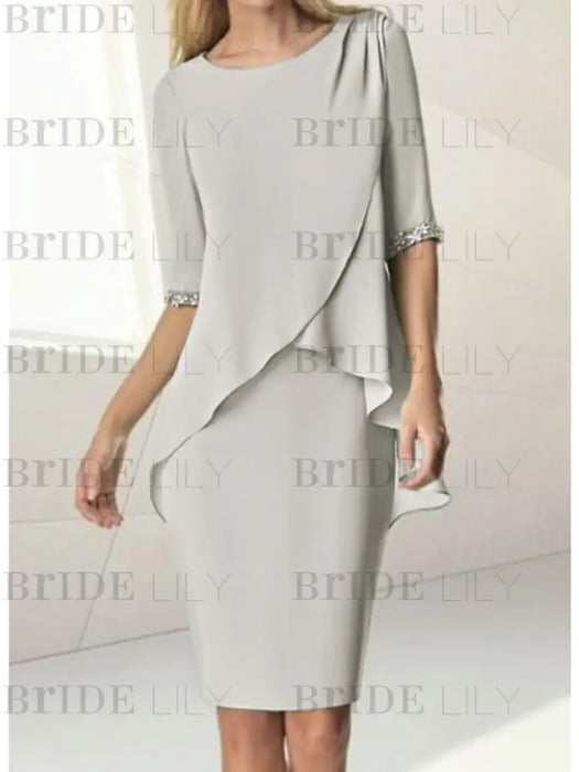 Chiffon overlay knee length dress with beaded cuffs in silver grey