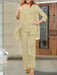 Chiffon three piece pantsuit with an open jacket in champagne beige