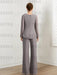 Back view of grey chiffon pantsuit with concealed zip and wide-leg trousers