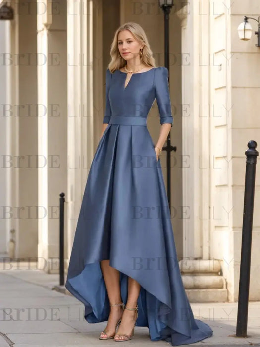 Dusty blue satin high low dress on model outdoors