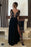 Elegant Black Evening Gown with Striking Sleeve Detail