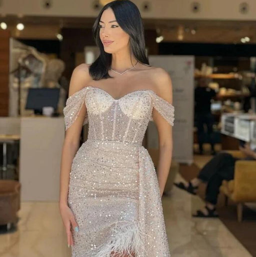 Elegant Champagne Sequin Prom Gown Featuring Feather Off-The-Shoulder Design