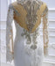 Elegant Long-Sleeve Pearl Sequin Bateau Mermaid Bridal Gown with Lace Beading