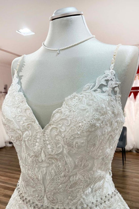 Elegant Long A-line Wedding Dress with V-neck, Spaghetti Straps, and Lace Ruffles