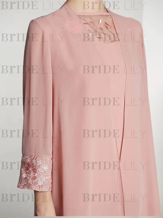 Close-up of the embroidered lace cuff on the blush pink chiffon jacket