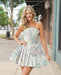 Floral Brocade Strapless Mini Dress with Bow & Pleated Skirt