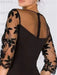 Close view of the black lace yoke and illusion back
