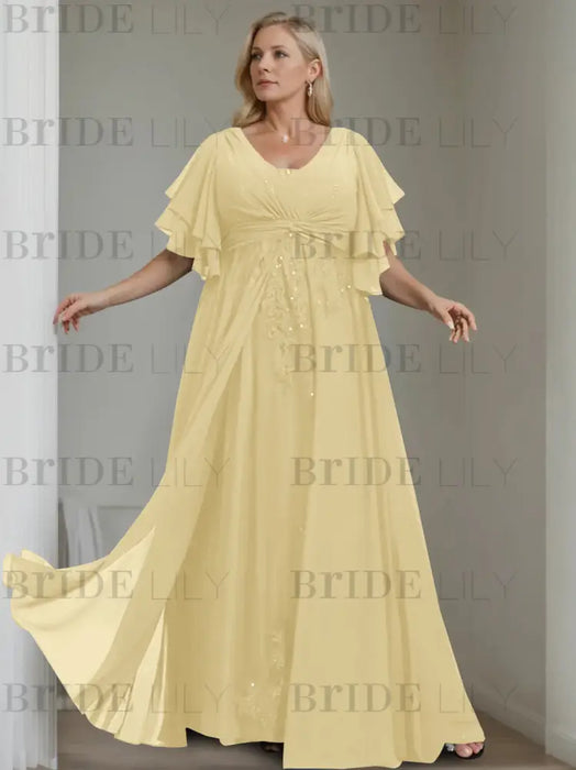 Plus size butter yellow chiffon gown with flutter sleeves