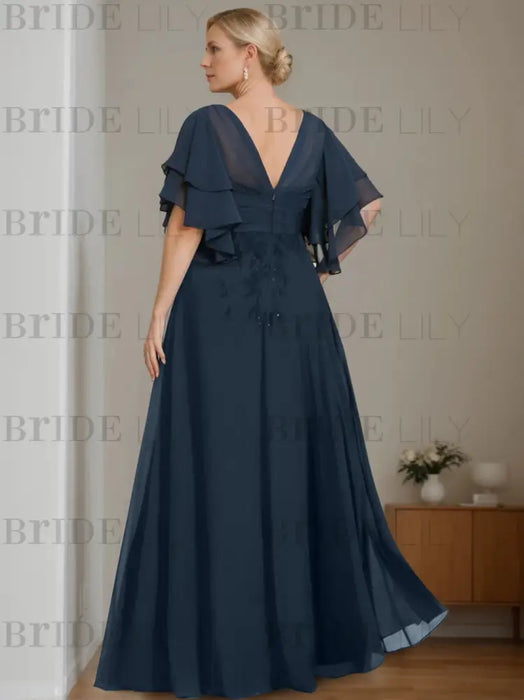Back of the navy chiffon gown with a V back