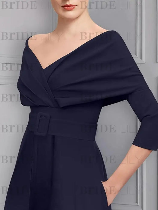 Close-up of the folded collar and covered belt in navy