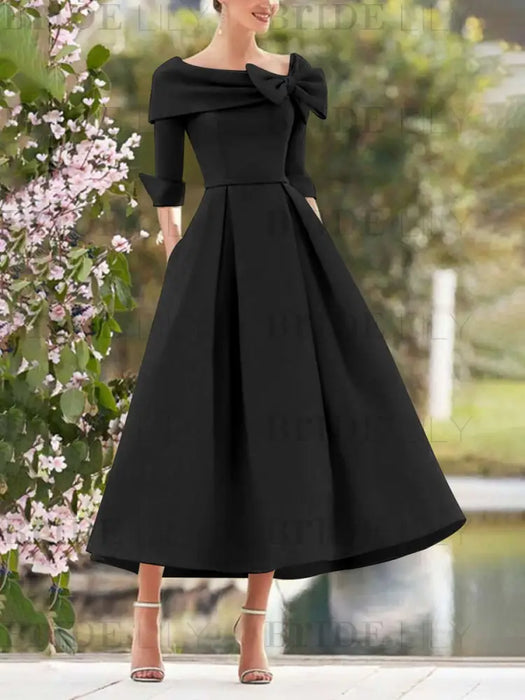 Folded collar dress with bow detail in black
