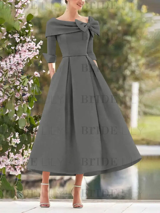 Folded collar dress with bow detail in charcoal grey