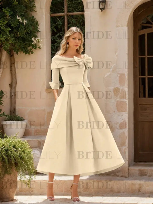 Folded collar dress with bow detail in ivory cream