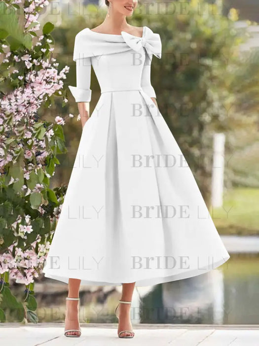 Folded collar dress with bow detail in white