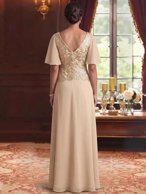 Back view of gold sequin lace bodice chiffon gown in champagne