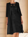 Black lace bodice dress worn with a long chiffon duster