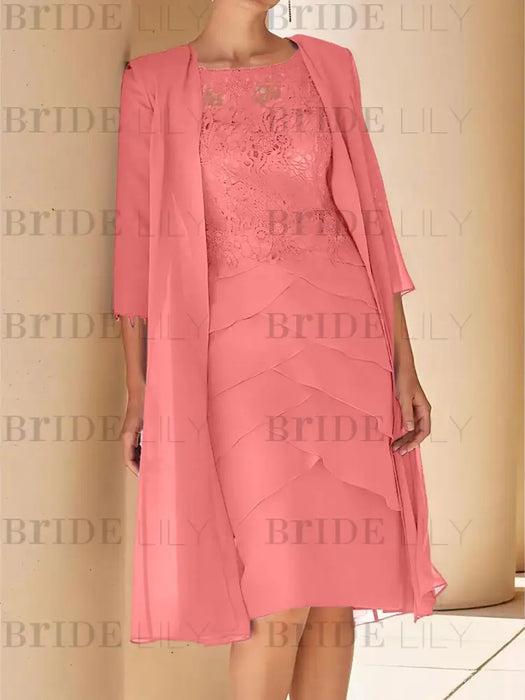 Coral pink lace bodice dress worn with a long chiffon duster