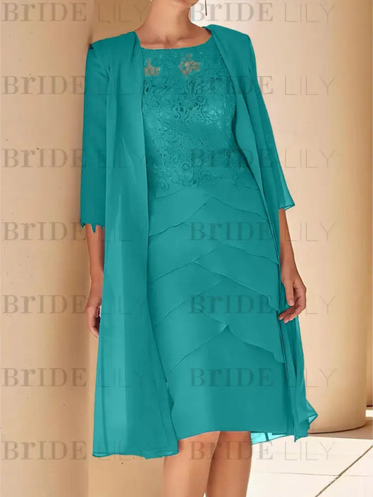 Teal lace bodice dress worn with a long chiffon duster