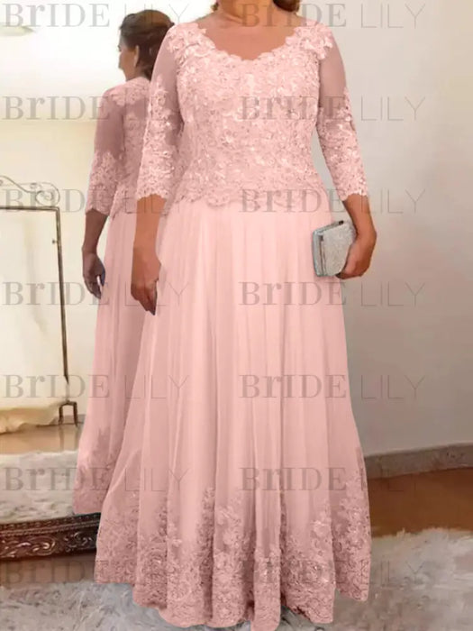 Lace and tulle gown with sheer sleeves in blush pink