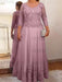 Lace and tulle gown with sheer sleeves in dusty mauve