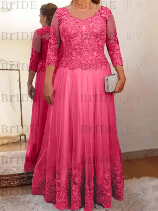 Lace and tulle gown with sheer sleeves in hot pink