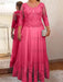 Lace and tulle gown with sheer sleeves in hot pink