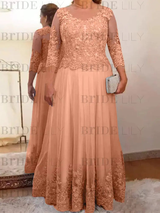 Lace and tulle gown with sheer sleeves in peach