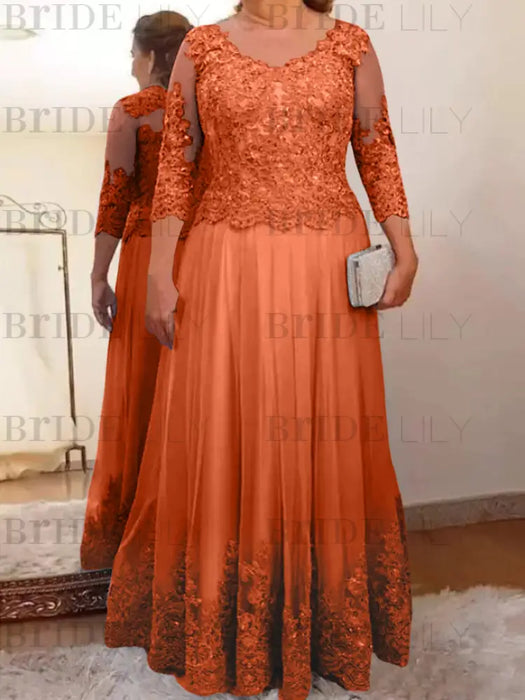 Lace and tulle gown with sheer sleeves in rust orange