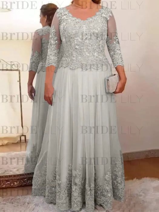 Lace and tulle gown with sheer sleeves in silver grey