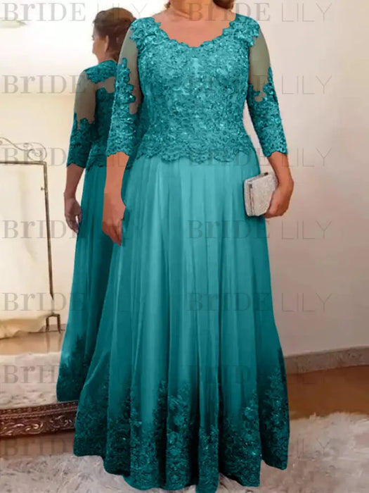 Lace and tulle gown with sheer sleeves in teal