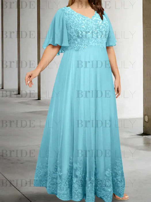 Plus size aqua chiffon gown with a sequin lace bodice and lace hem
