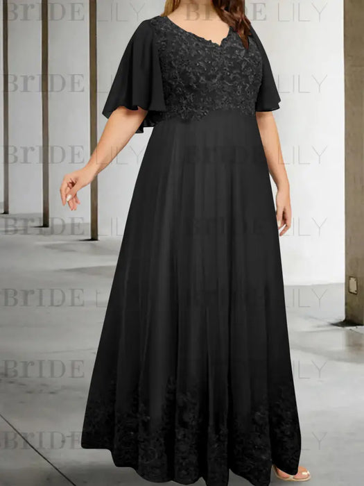 Plus size black chiffon gown with a sequin lace bodice and lace hem