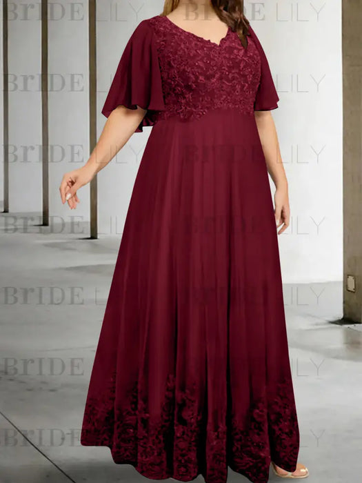 Plus size burgundy chiffon gown with a lace bodice and lace hem