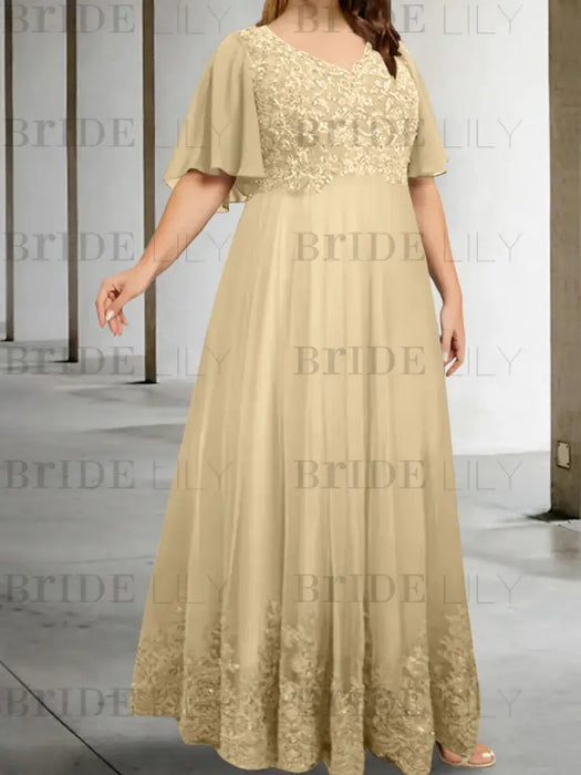 Plus size champagne chiffon gown with a lace bodice and lace hem