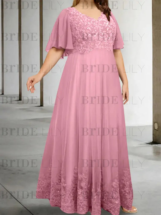 Plus size dusty pink chiffon gown with a lace bodice and lace hem