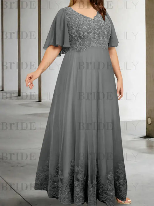 Plus size grey chiffon gown with a lace bodice and lace hem band