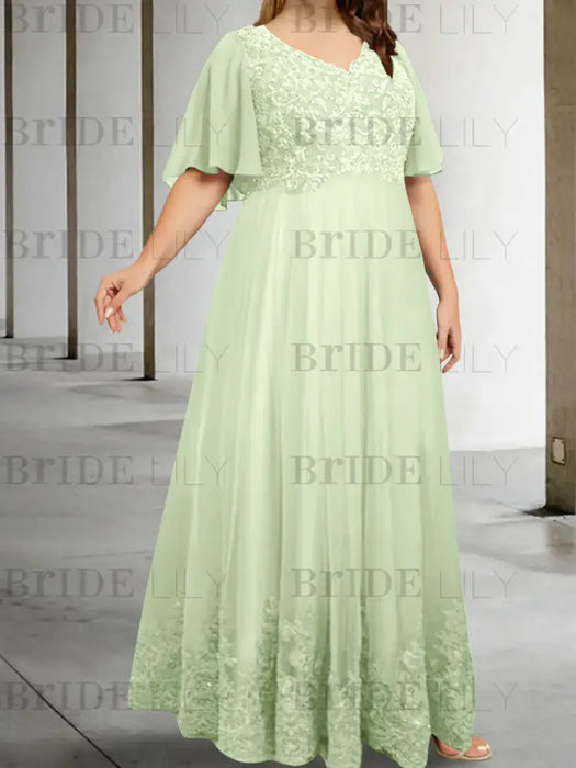 Plus size pale green chiffon gown with a lace bodice and lace hem