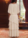 Back view of ivory chiffon cape sleeve gown with tiered skirt