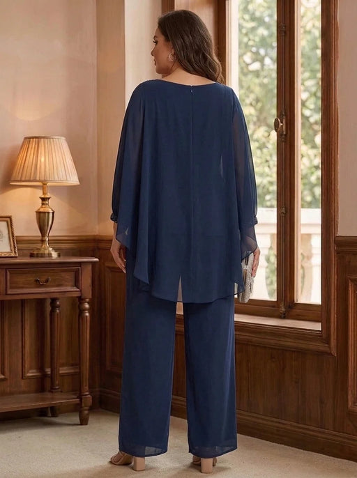 Back view of navy chiffon cape overlay pantsuit with wide-leg trousers