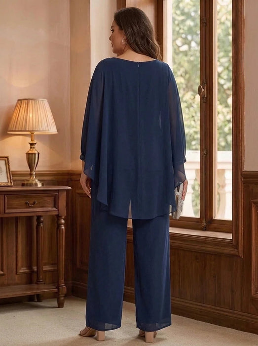 Back view of navy chiffon cape overlay pantsuit with wide-leg trousers