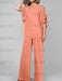 Salmon mother of the bride chiffon pantsuit with ruffle cape top