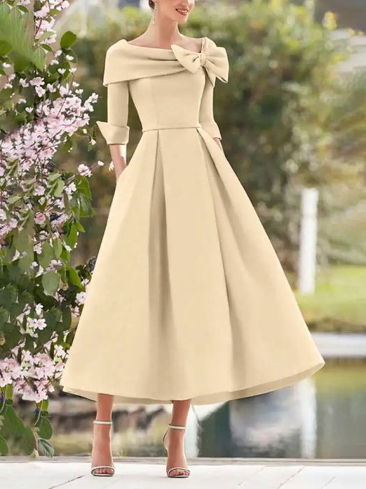 Mother of the bride dress with folded collar and bow in champagne