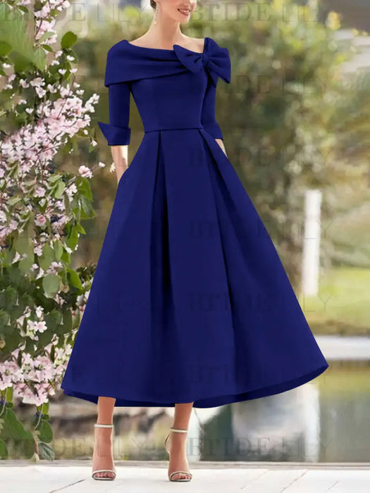 Dark Royal Blue mother of the bride dress with folded collar and bow detail