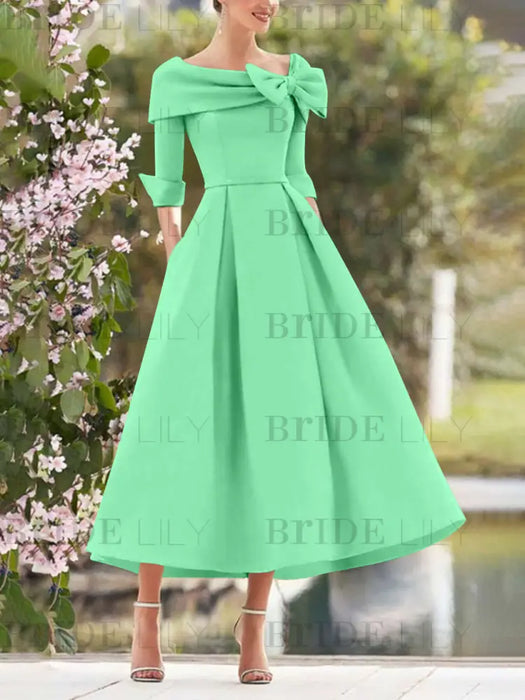Mint Green mother of the bride dress with folded collar and bow detail
