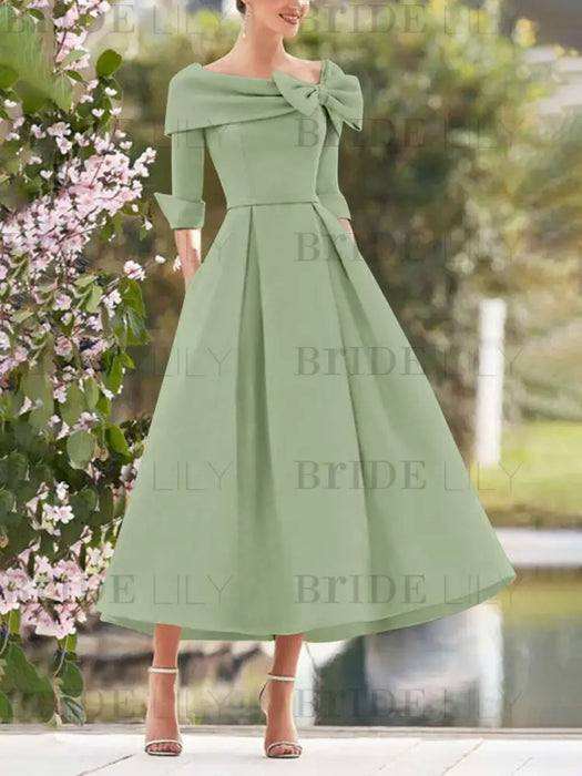 Sage mother of the bride dress with folded collar and bow detail