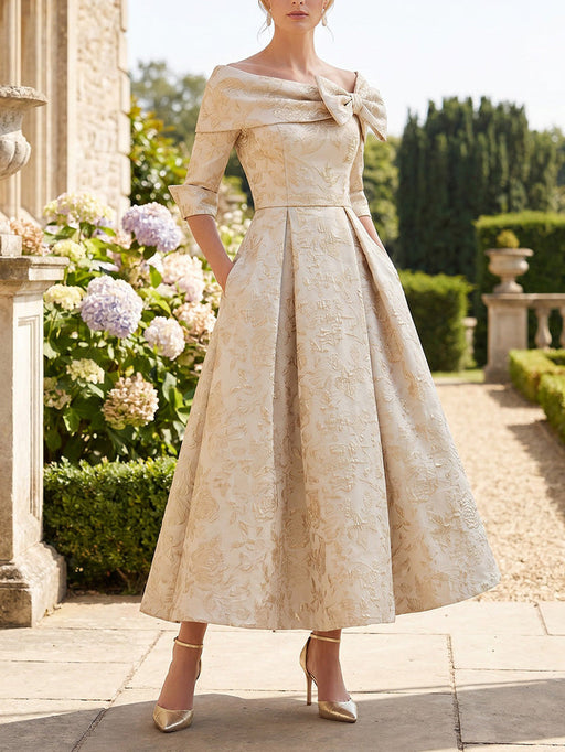 Mother of the bride jacquard dress with off the shoulder bow in champagne