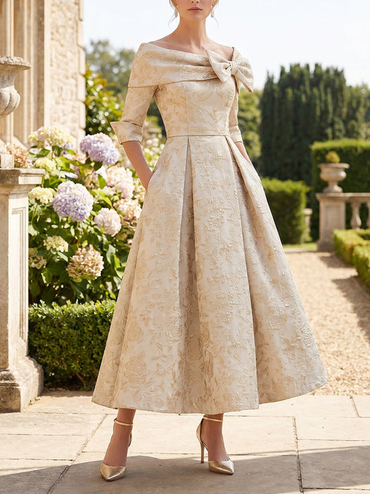 Mother of the bride jacquard dress with off the shoulder bow in champagne