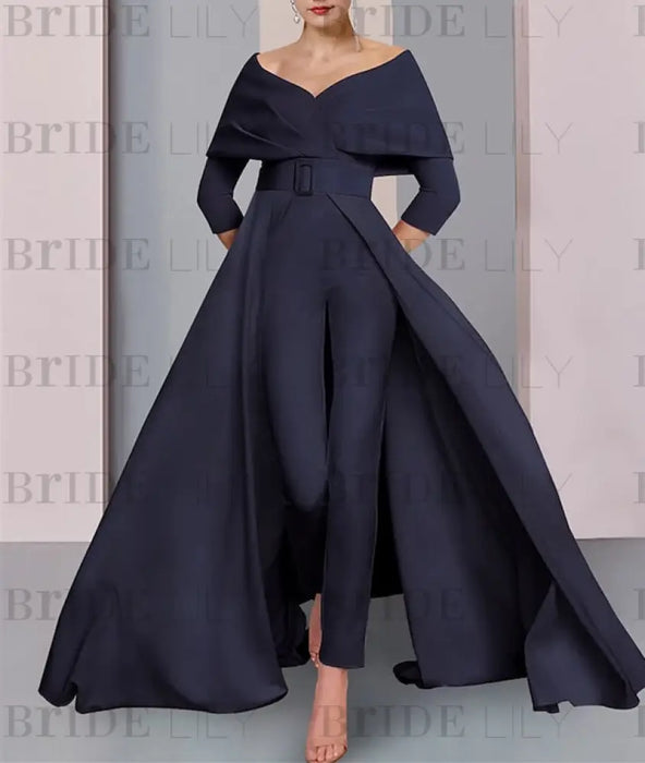 Full length view of the navy jumpsuit and sweeping overskirt