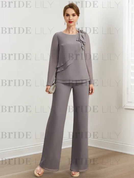 Grey chiffon pantsuit with crystal shoulder trim styled with a clutch